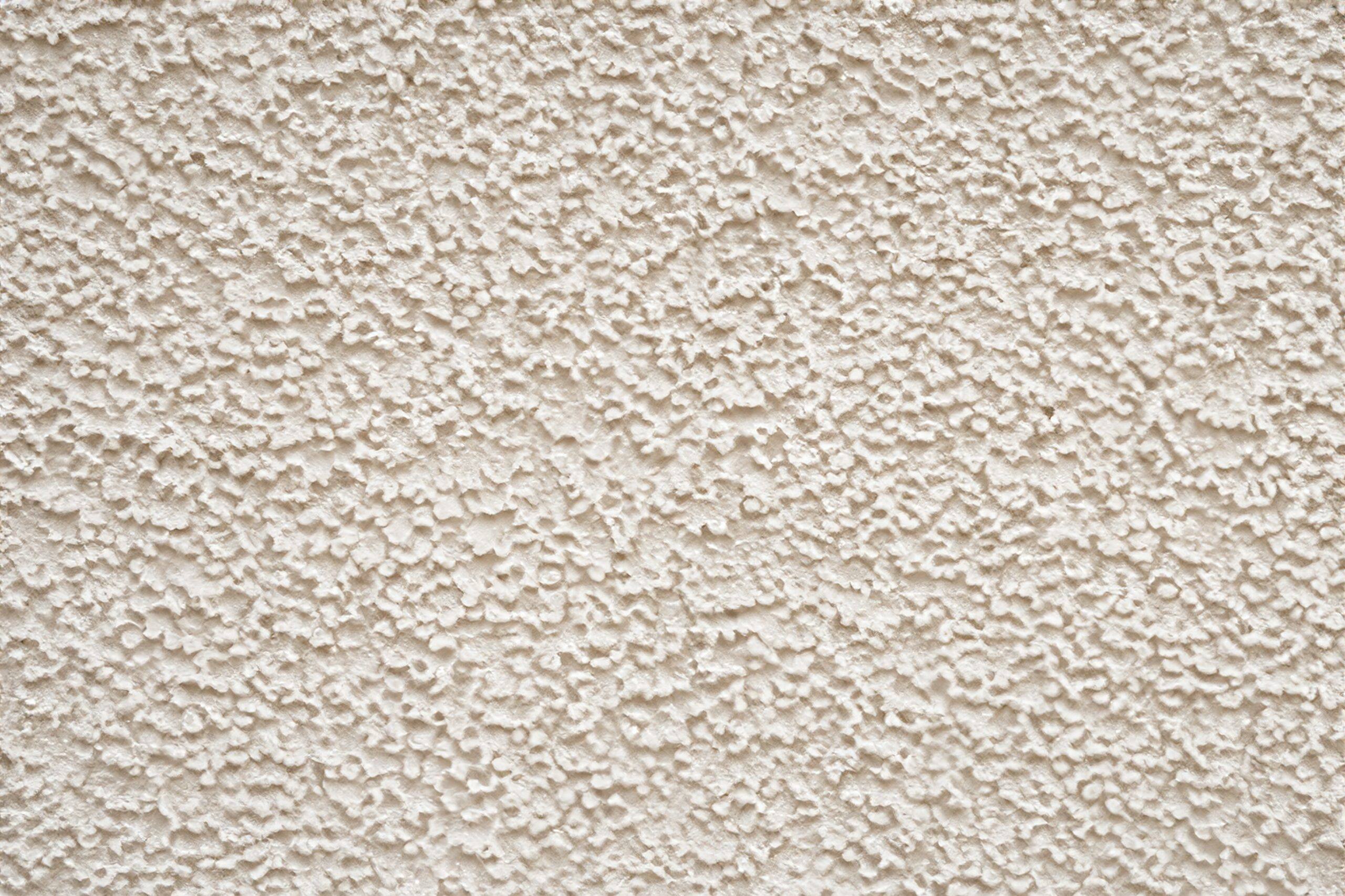 Detalle macro de pared con gotelé en tono crema